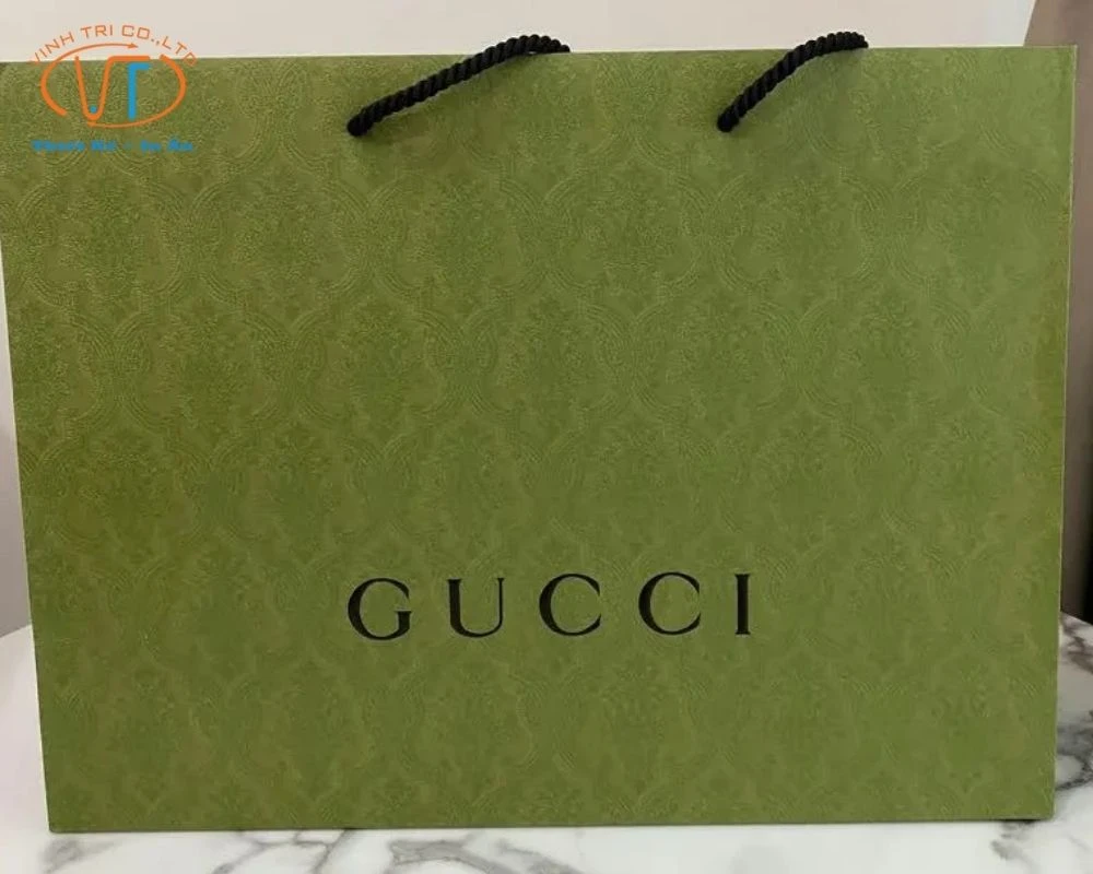 Túi giấy Gucci quai trắng màu xanh